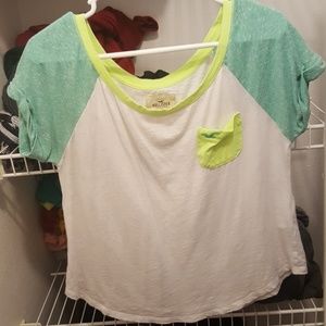 a white/green/yellow tee shirt